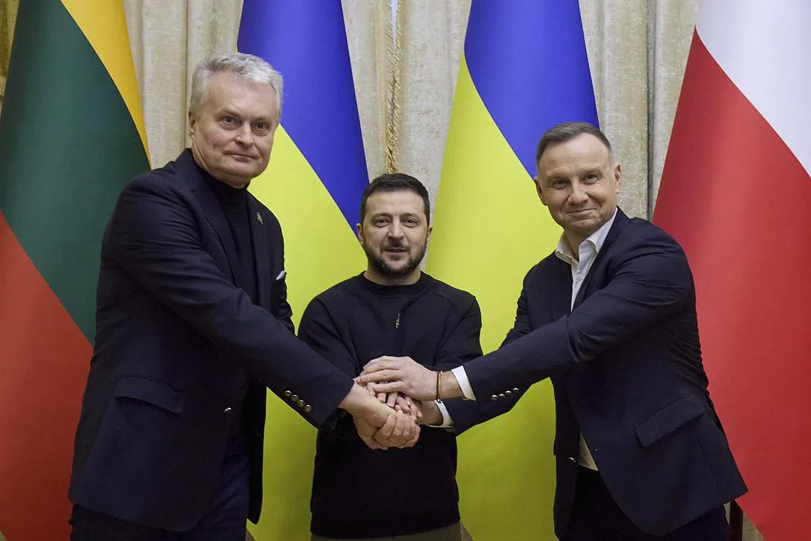 epa10400247 A  handout picture made available by the Presidential Press Service shows Ukrainian President Volodymyr Zelensky (C), Polish President Andrzej Duda (R), and Lithuanian President Gitanas Nauseda (L) attending a joint press conference after their meeting in the Western Ukrainian city of Lviv, Ukraine, 11 January 2023. Andrzej Duda and Gitanas Nauseda arrived in Lviv to meet with top Ukrainian officials, take part in the Second Summit of the Lublin Triangle, and express their support for Ukraine amid the Russian invasion.  EPA-EFE/PRESIDENTIAL PRESS SERVICE HANDOUT HANDOUT HANDOUT HANDOUT EDITORIAL USE ONLY/NO SALES