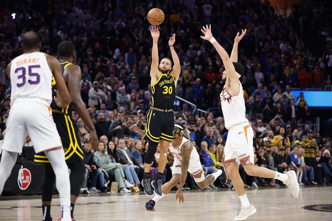 Stephen Curry of the Golden State Warriors making the game-winning three-point basket late in the fourth quarter against the Phoenix Suns at Chase Center on Feb 10. The Warriors won the NBA game 113-112.