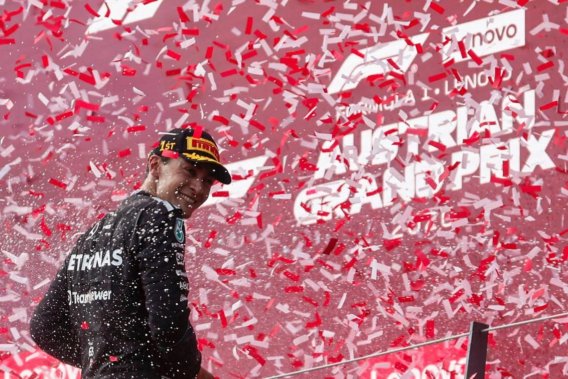 Formula One F1 - Austrian Grand Prix - Red Bull Ring, Spielberg, Austria - June 28, 2026 Mercedes' George Russell celebrates on the podium after winning the Austrian Grand Prix REUTERS/Lisa Leutner