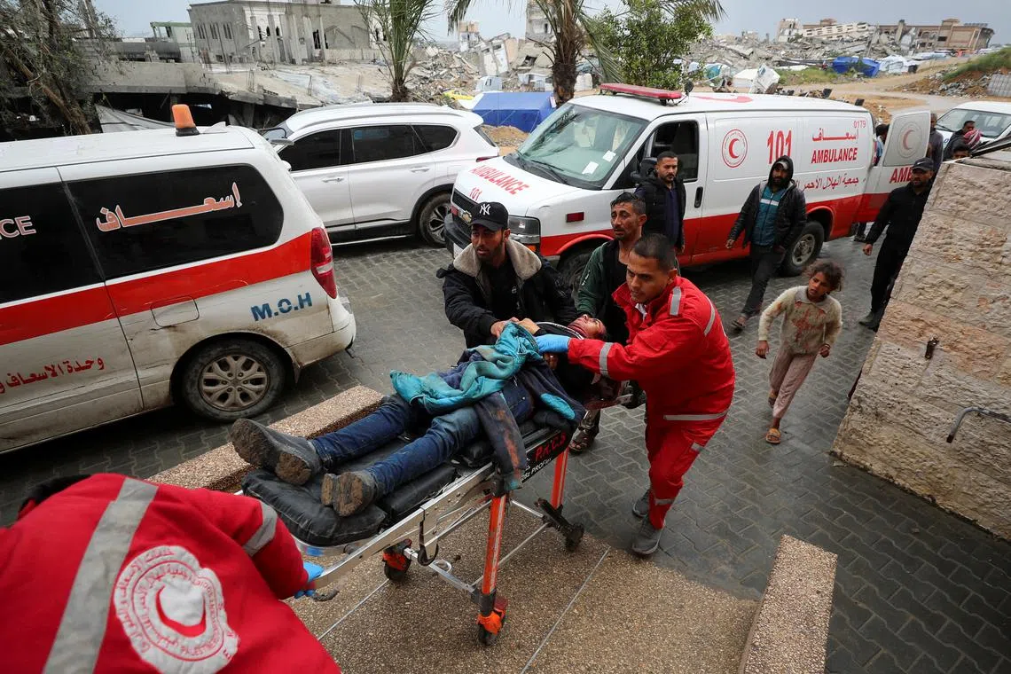 A Palestinian casualty is brought to the Indonesian hospital following Israeli strikes in Beit Lahia, in the northern Gaza Strip March 20, 2025. REUTERS/Mahmoud Issa