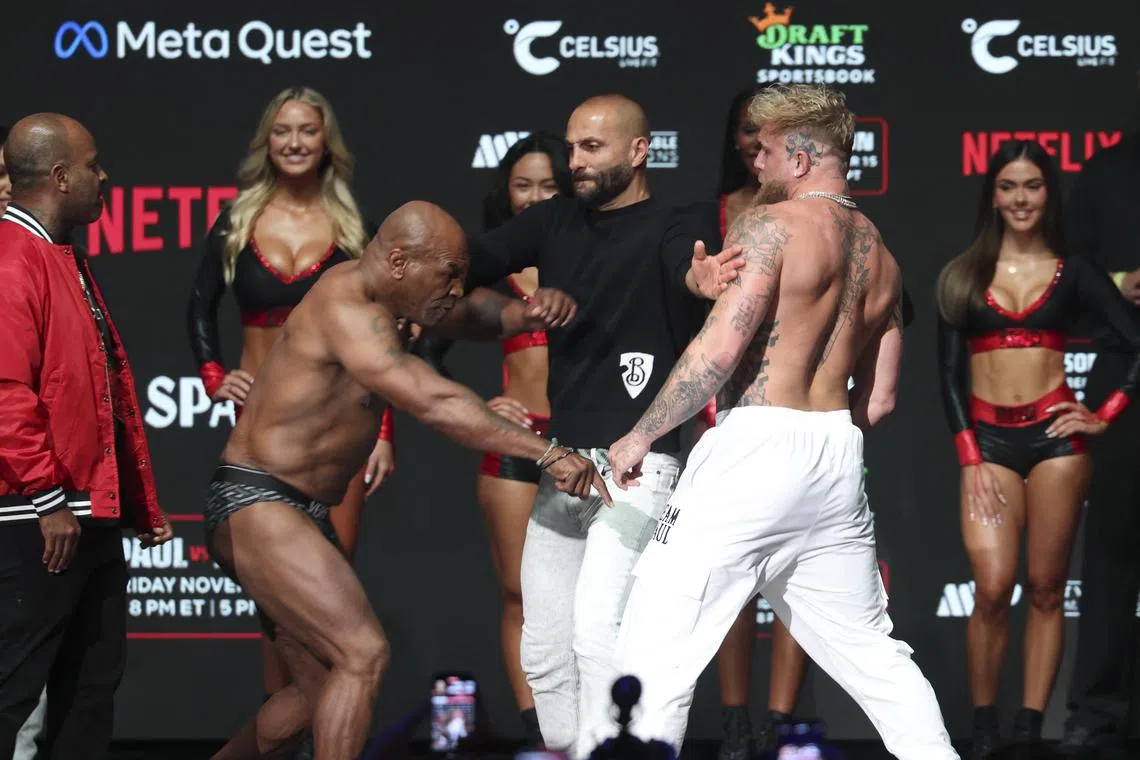 Nov 14, 2024; Irving, TX, USA;  Jake Paul and Mike Tyson face off during weigh-ins at the Toyota Music Factory the day before their fight.  Mandatory Credit: Kevin Jairaj-Imagn Images/ File Photo