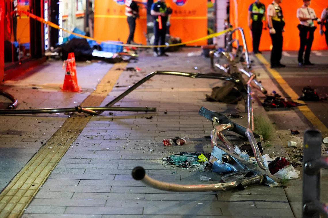Broken glass and debris lie at the scene of car accident that resulted in several people killed and injured in central Seoul, South Korea on July 1, 2024.