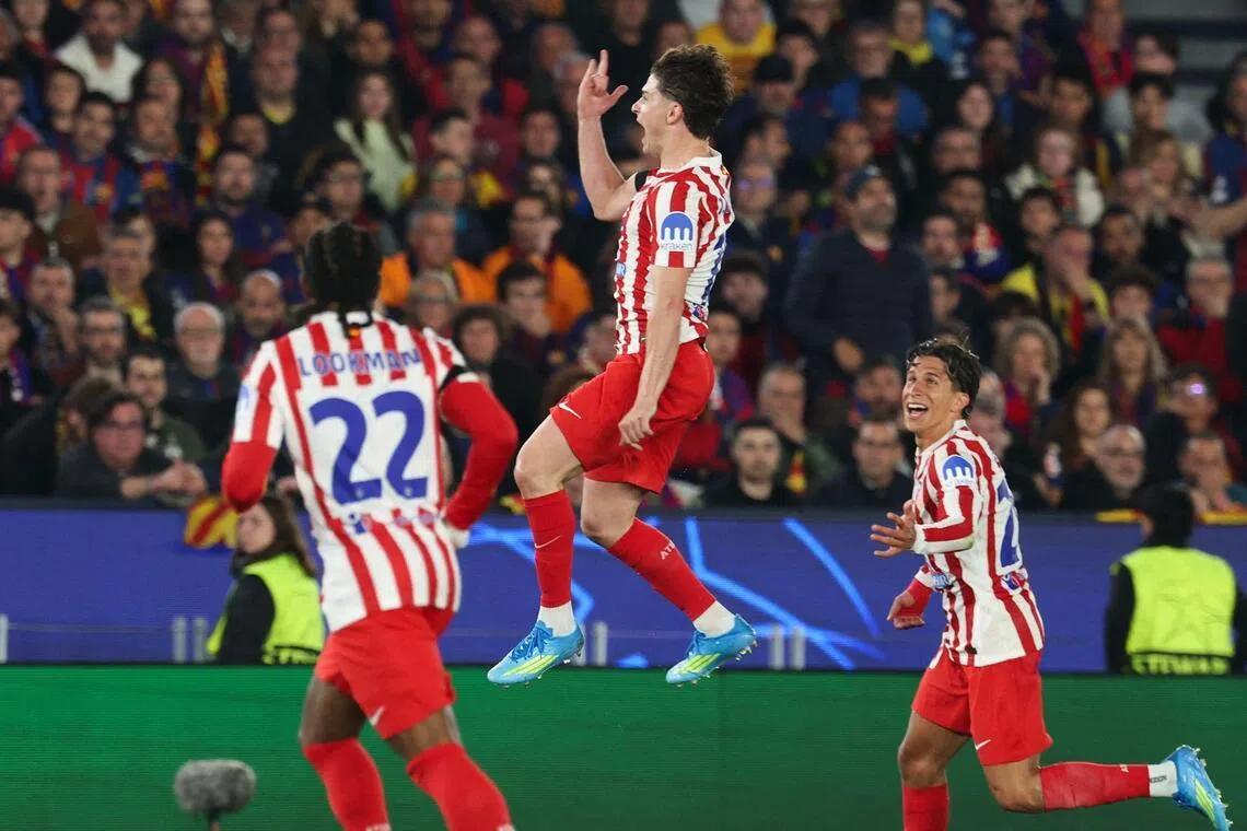 Atletico Madrid storm Camp Nou with 2-0 Champions League win over 10-man ...