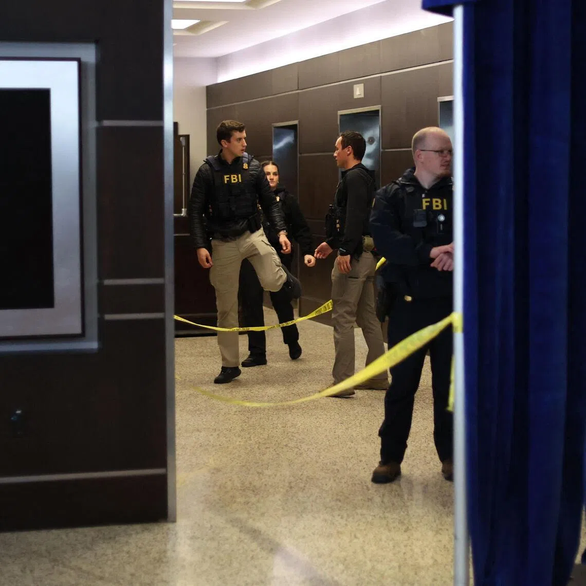 FBI agents are seen at the Washington Hilton after shots were fired during the White House Correspondents dinner on April 25, 2025.  