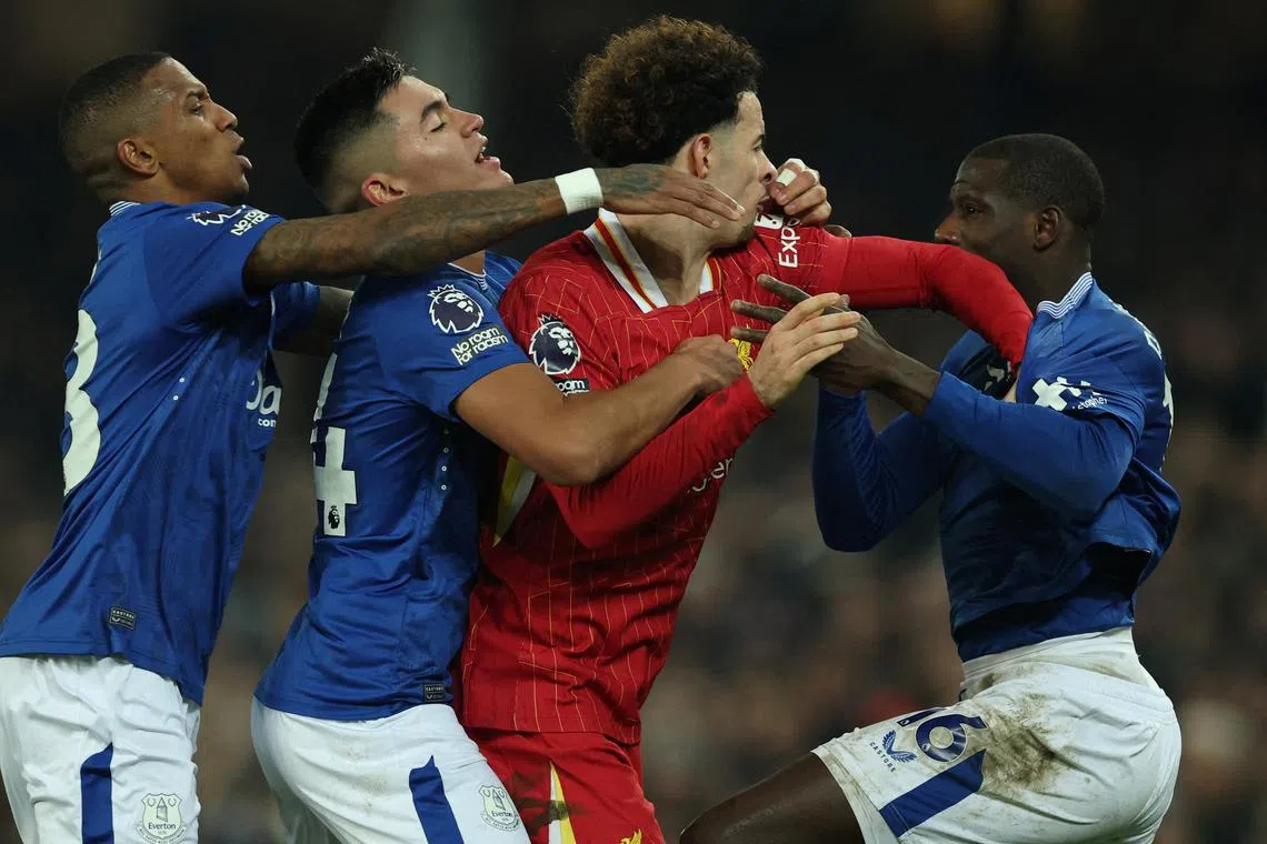 FILE PHOTO: Soccer Football - Premier League - Everton v Liverpool - Goodison Park, Liverpool, Britain - February 12, 2025 Liverpool's Curtis Jones clashes with Everton's Abdoulaye Doucoure after the match before both players are sent off REUTERS/Phil Noble/File Photo