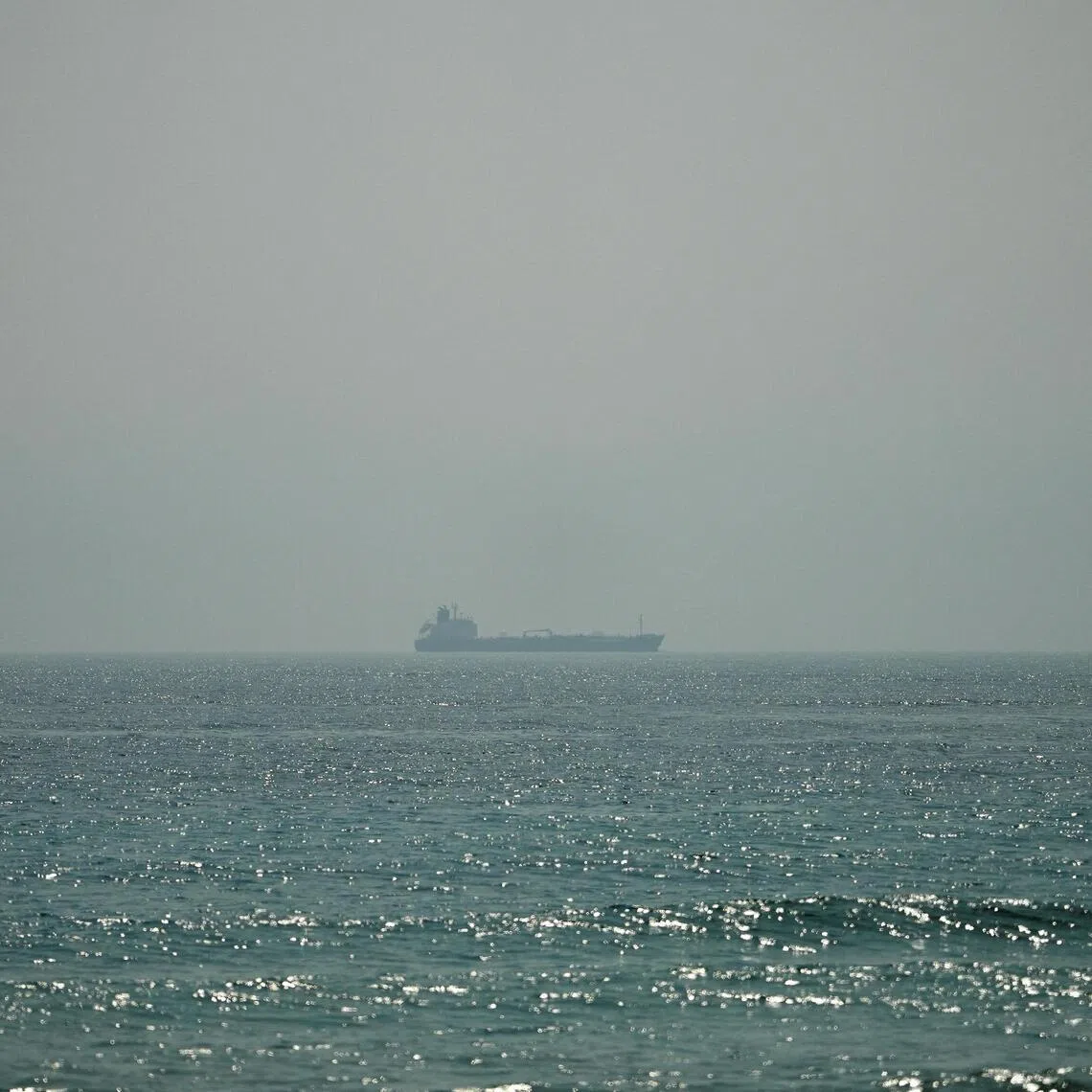 Oil tanker Al Shaffiah sails at the sea near the Omani coast, as seen from Musandam, Oman, June 26, 2026. REUTERS/Stringer