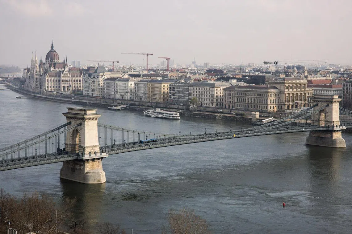 The Chain Bridge and Hungary's Parliament building from the Buda side the Danube River in Budapest, Hungary, on Saturday, March 9, 2024. Viktor Orban’s son-in-law, Istvan Tiborcz, has emerged as the country’s most prominent investor in the tourism industry, including half a dozen hotels in Budapest either finished or under reconstruction. Photographer: Akos Stiller/Bloomberg