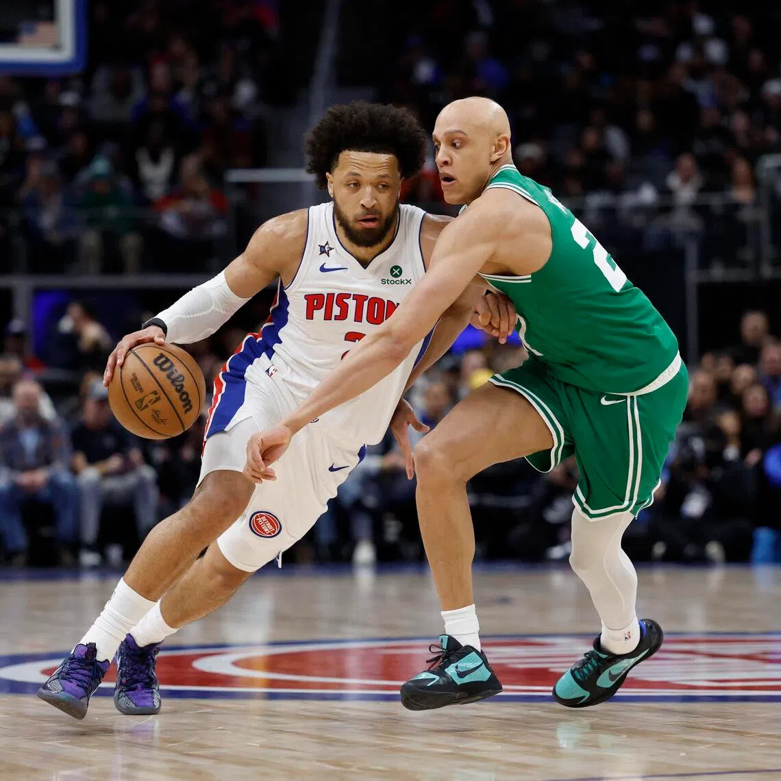 Detroit Pistons guard Cade Cunningham drives against Boston Celtics guard Jordan Walsh in the second half at Little Caesars Arena.