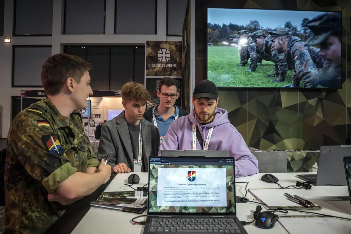 A German Army recruitment booth during a tech trade show in Berlin on May 23, 2025. In a recent survey, only 17 percent of Germans said they would defend their country if attacked. (Sergey Ponomarev/The New York Times)