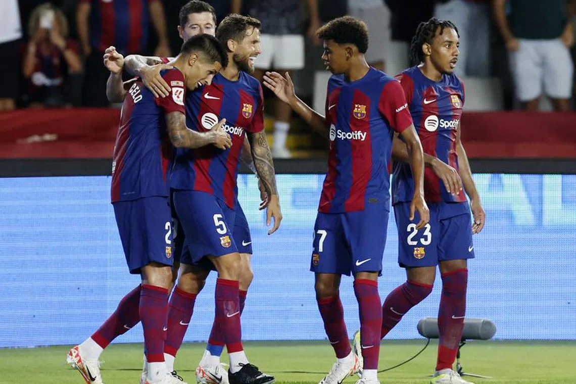 Soccer Football - LaLiga - FC Barcelona v Real Betis - Estadi Olimpic Lluis Companys, Barcelona, Spain - September 16, 2023 FC Barcelona's Joao Cancelo celebrates scoring their fifth goal with Inigo Martinez, Robert Lewandowski, Lamine Yamal and Jules Kounde REUTERS/Albert Gea