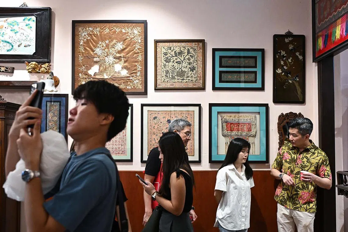 Embroidered works on display on the second floor of Kim Choo Kueh Chang store during a media preview of the Heritage Activation Node @ Katong-Joo Chiat Launch Festival on April 12, 2024. Katong-Joo Chiat is known for its rich and varied heritage and culture, with colourful shophouses, traditional businesses, hip cafes, and a vibrant community. 