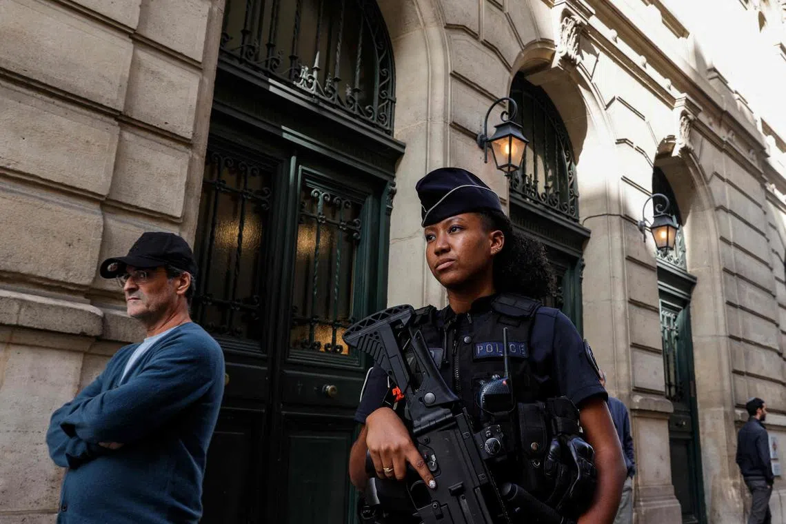 A French police officer patrolling outside the Tournelles Synagogue with a G36 assault rifle on Oct 8, 2023.