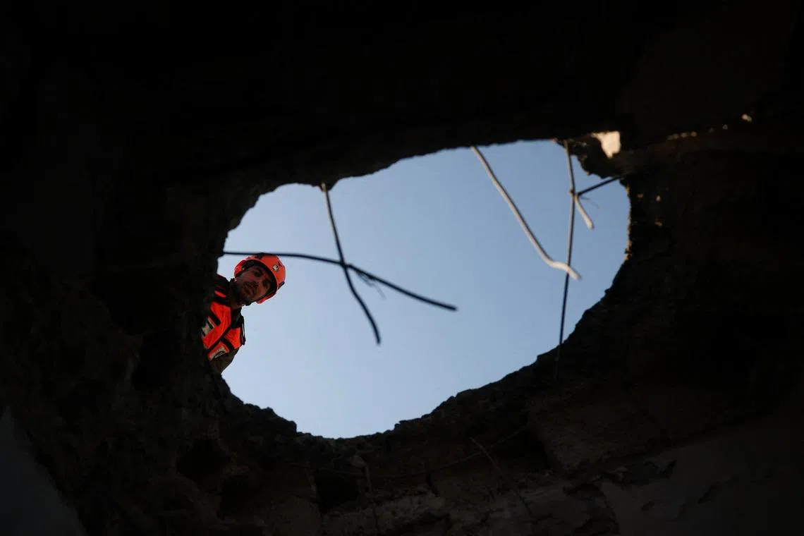 An emergency personnel member working at the site of an Iranian missile strike, amid the U.S.-Israel conflict with Iran, in Petah Tikva, Israel, on March 3, 2026. 