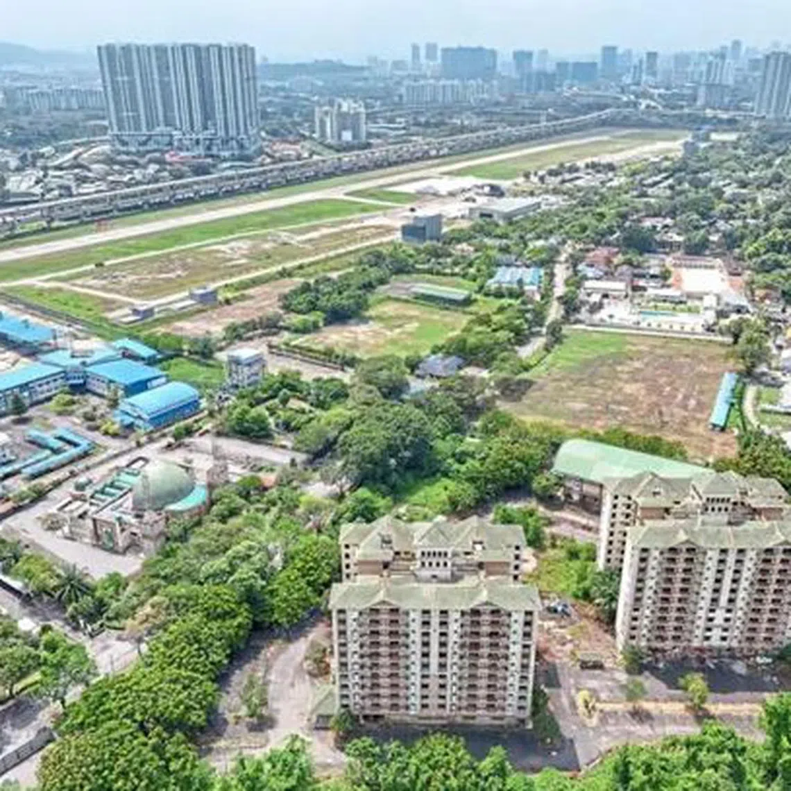 Aerial view of Bandar Malaysia site, with Razak City Residence to the left of the airstrip and 1Razak Mansion next to it. 