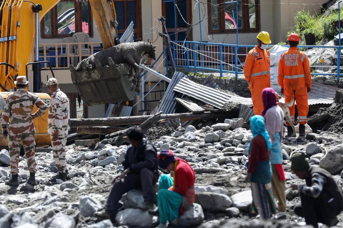 epa12297422 Indian rescue teams recover the body of a dead mule after the cloudburst in Dharali village in Uttarkashi district, Uttarakhand state, northern India, 12 August 2025 (issued 13 August 2025). Indian authorities confirmed that more than 1,200 people had been rescued in several areas of the Himalayas, after a powerful cloudburst struck the Dharali area in the Uttarkashi district on 05 August, triggering flash floods that swept away a village and left several people dead.  EPA/RAJAT GUPTA
