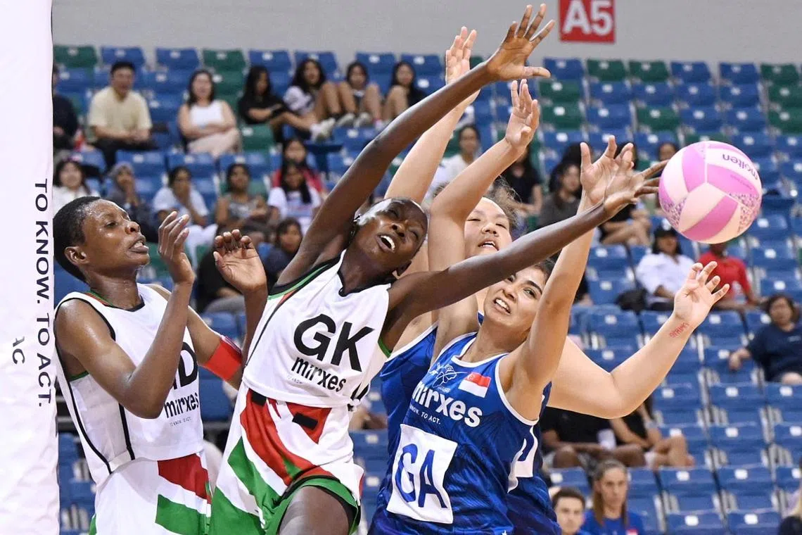 Kenyan goalkeeper Jackline Adhiambo Auro and Singapore's Amandeep Chahal fighting for the ball during their Mirxes Nations Cup match on Sept 3.