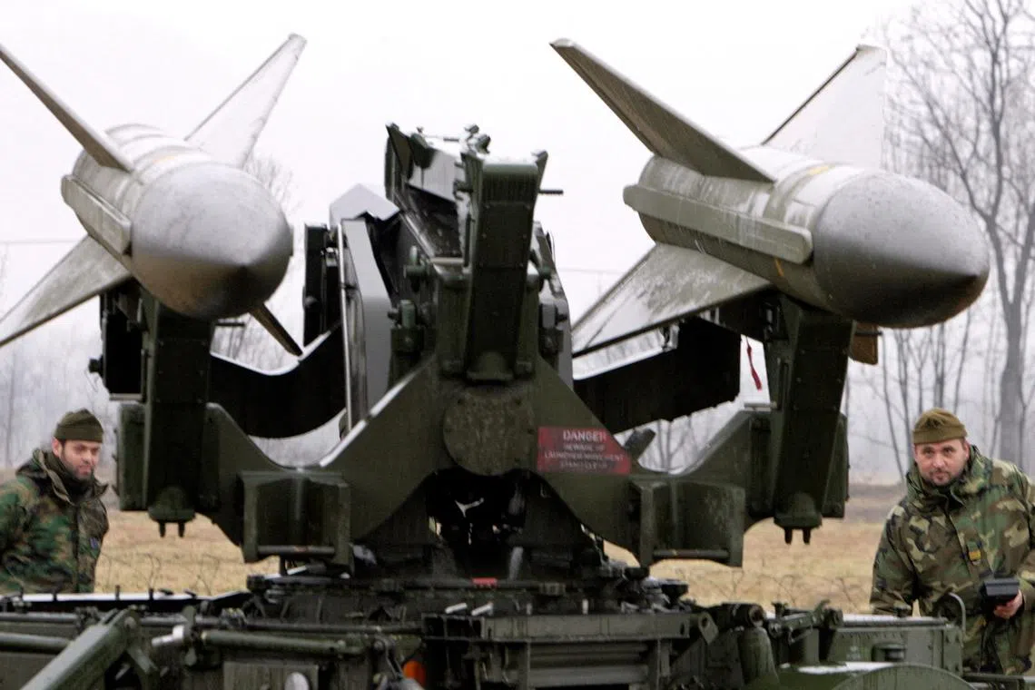 FILE PHOTO: Soldiers from an Italian army anti-aircraft artillery regiment check a HAWK missile launcher guarding the Torino 2006 Winter Olympic Games near Turin, Italy February 24, 2006. REUTERS/Chris Helgren/File Photo