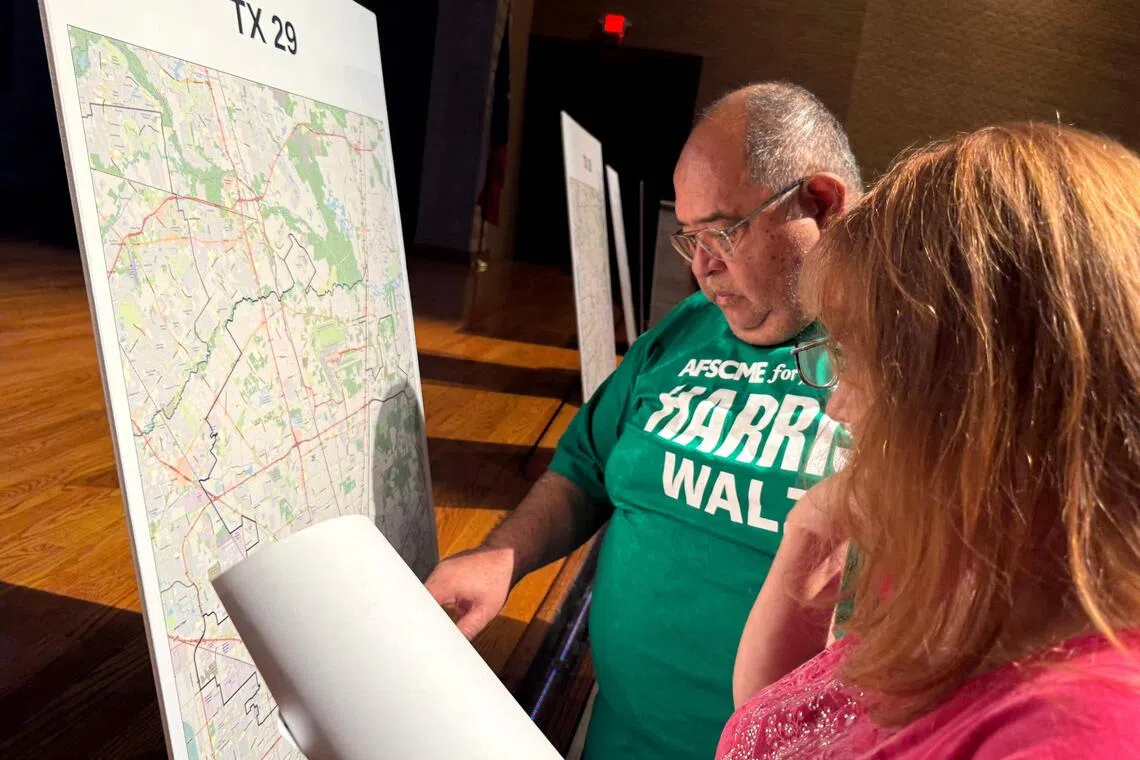 Voters look at a map to understand the new redistricting maps approved by Texas lawmakers for the 2026 midterm elections, in Houston, Texas, on Aug 27.