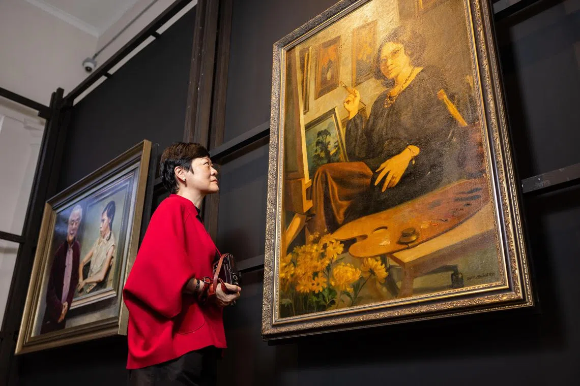 ST20250624_202548400944/shsg02/Brian Teo/Shawn Hoo/Profile of Dr Chua Yang, a photographer and founder of A Clinic For Women, at the exhibition 'The Art of Lee Boon Ngan: Celebrating 60 Years of Singapore through the Love of Chua Mia Tee & Lee Boon Ngan', featuring works by her father, Cultural Medallion recipient Chua Mia Tee and mother,Lee Boon Ngan, who is also an artist, at the The Private Museum on June 24, 2025. ST PHOTO: BRIAN TEO 