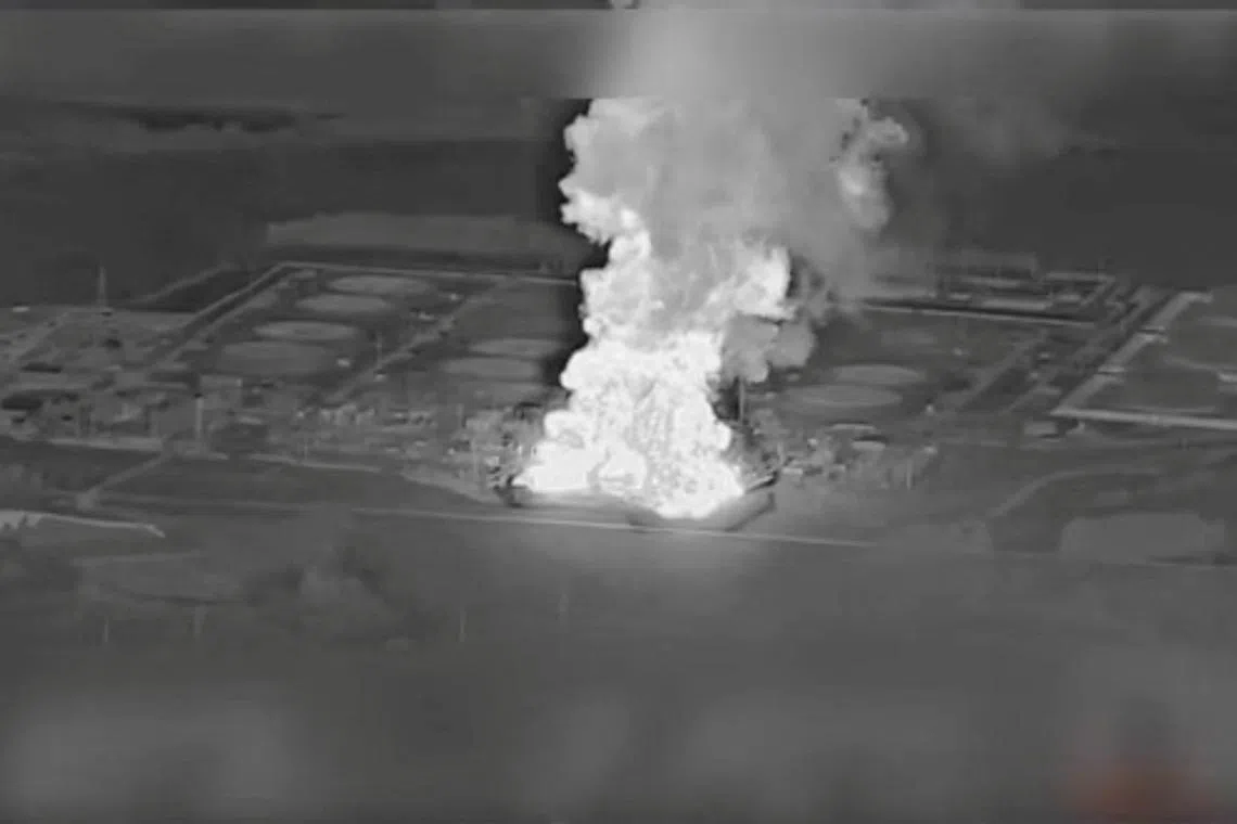Smoke rises from the Unecha oil pumping station during a fire, in Unechsky district, Bryansk region, Russia, August 21, 2025 in this night vision still image obtained from social media video. YouTube @MAGYARBIRDS via REUTERS