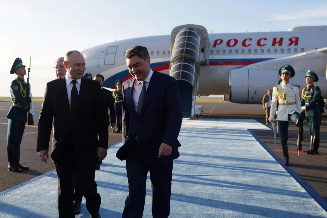 Russian President Vladimir Putin is greeted by Kazakh Prime Minister Olzhas Bektenov during a welcoming ceremony upon his arrival at an airport in Astana, Kazakhstan July 3, 2024. Sputnik/Gavriil Grigorov/Pool via REUTERS