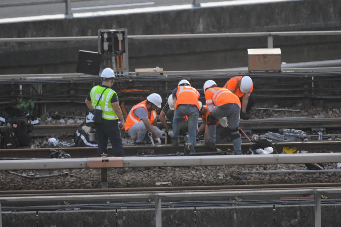 Work being carried out on the affected train and train track outside Ulu Pandan Depot, at around 6.30pm on Sept 25, 2025.