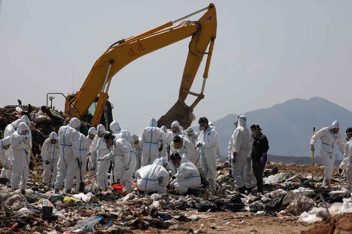 Police officers combing through garbage, searching for the remains of murdered model and influencer Abby Choi in a landfill site in Hong Kong, China, Feb 28, 2023. Choi’s gruesome murder came to light last week after police found two severed legs, believed to be hers, inside a flat, followed by a skull and several ribs discovered in a large soup pot seized from the property.  
