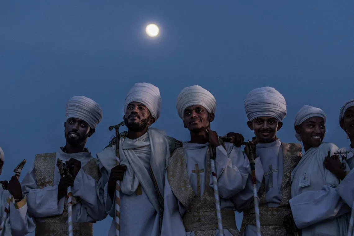 Orthodox deacons looking on during the celebrations of the Ethiopian Orthodox holiday of Meskel in Addis Ababa on Sept 27.