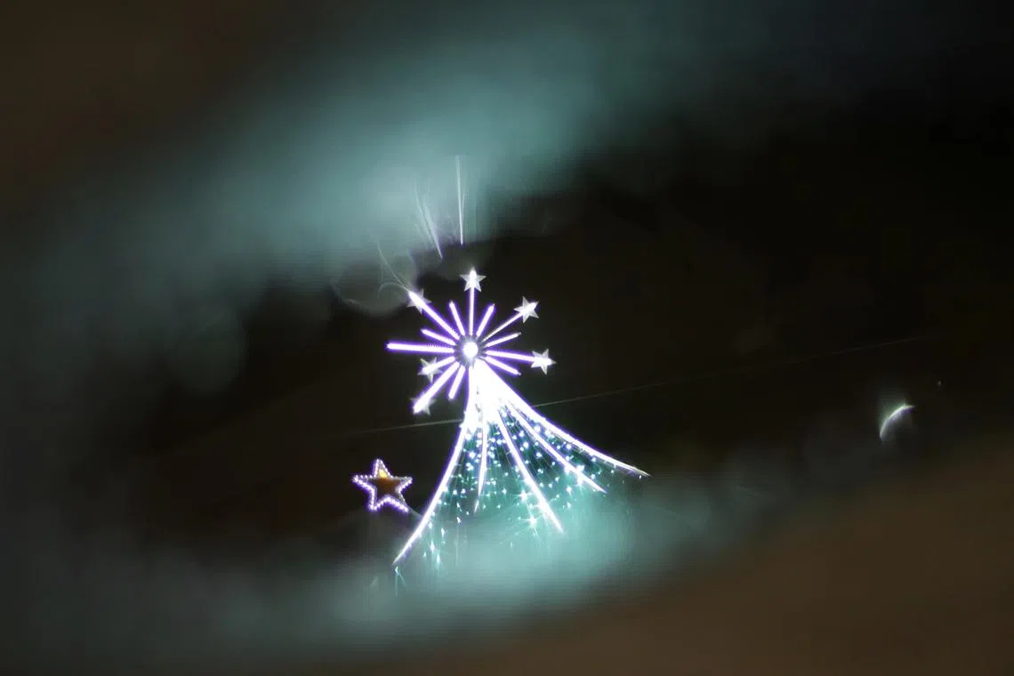 A reflection of the Christmas lights in Orchard Road.