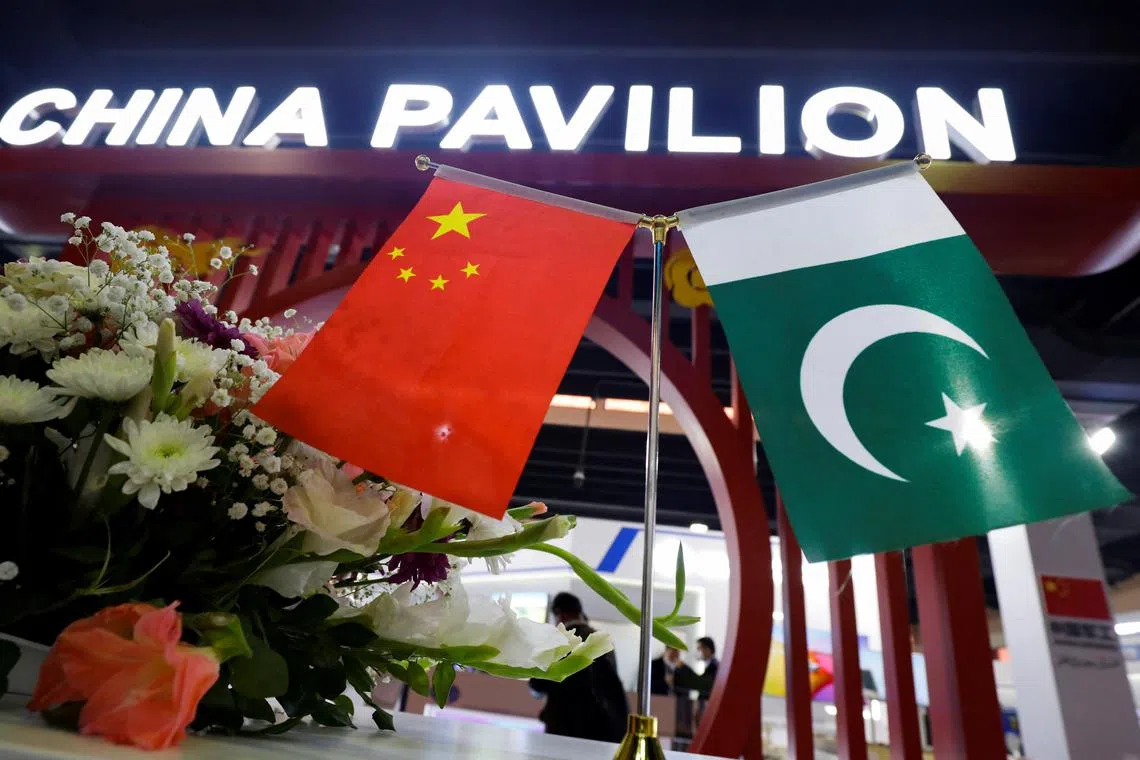 Flags of Pakistan and China are seen at the entrance of the China Pavilion, during the International Defence Exhibition and Seminar \"IDEAS 2022\" in Karachi, Pakistan November 16, 2022. REUTERS/Akhtar Soomro