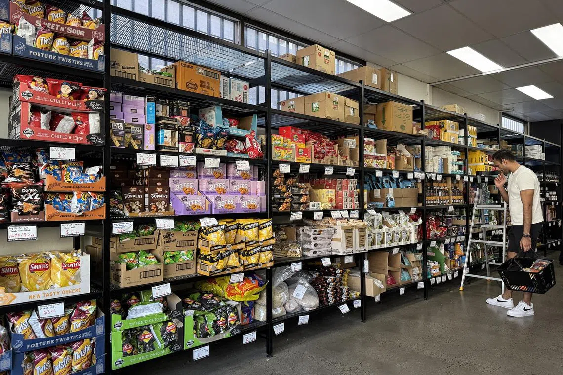 Shelves stocked with cheap snacks from as little as A$1 a pack.