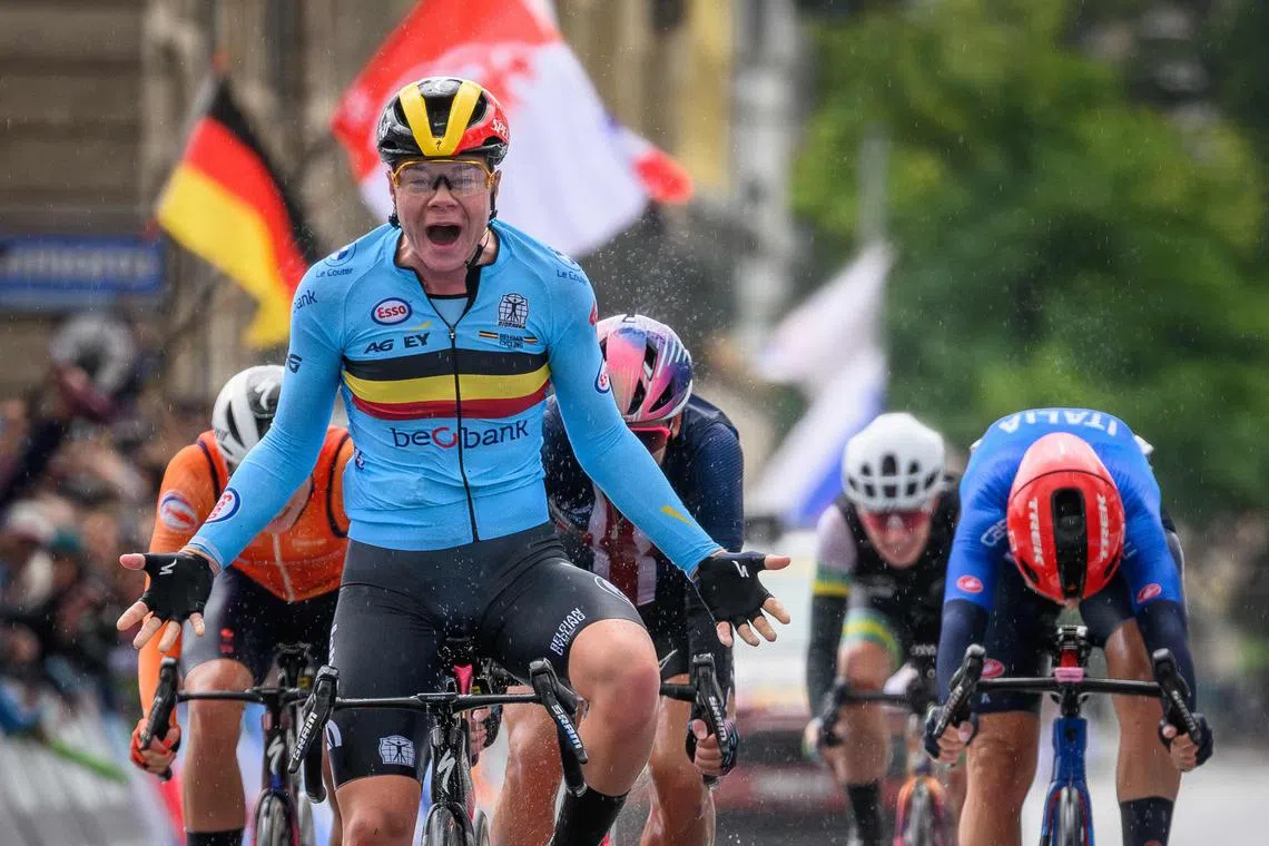 Belgian cyclist Lotte Kopecky crossing the finishing line to win the women's elite road race during the UCI 2024 Road World Championships in Zurich on Sept 28.