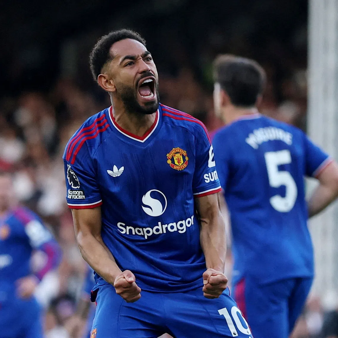 Manchester United’s Matheus Cunha celebrates scoring their first goal against Fulham.