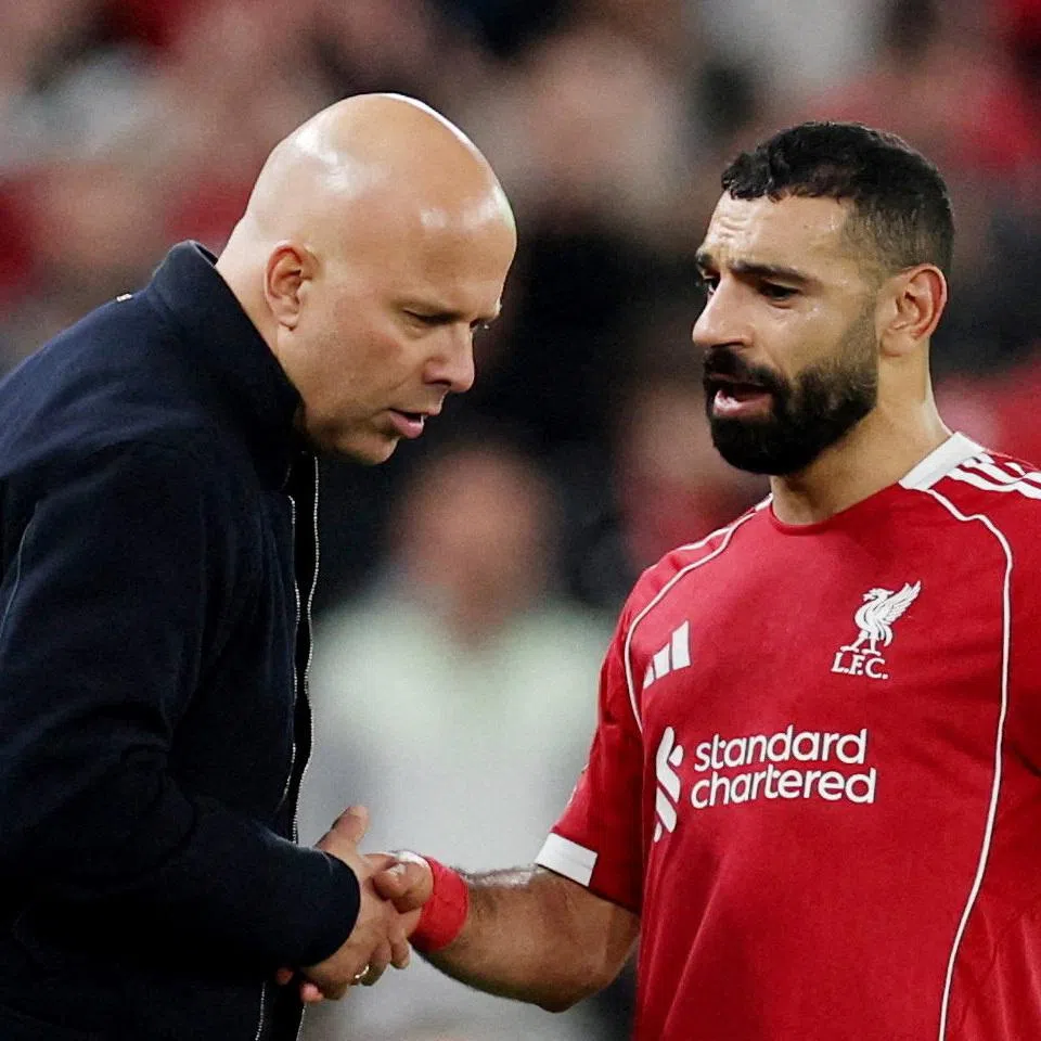 FILE PHOTO: Soccer Football - UEFA Champions League - Round 16 - Second Leg - Liverpool v Galatasaray - Anfield, Liverpool, Britain - March 18, 2026 Liverpool's Mohamed Salah shakes hands with manager Arne Slot after being substituted REUTERS/Phil Noble/File Photo