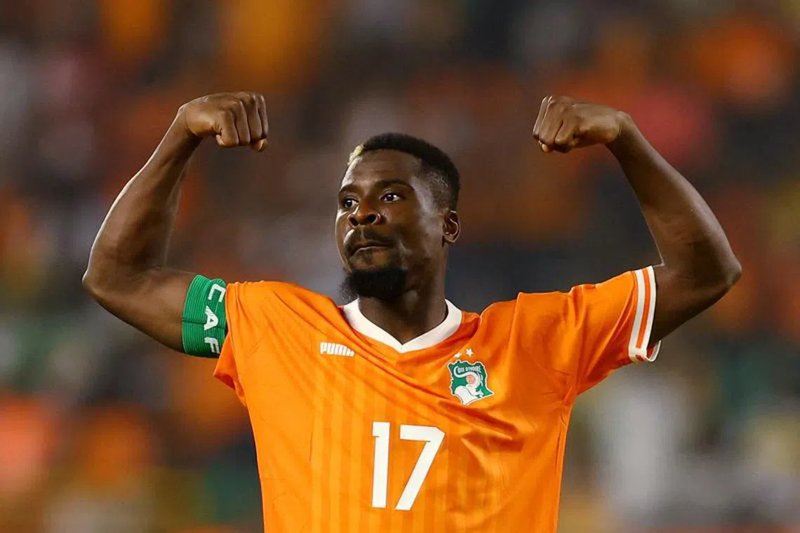 Soccer Football - Africa Cup of Nations - Round of 16 - Senegal v Ivory Coast - Charles Konan Banny Stadium, Yamoussoukro, Ivory Coast - January 29, 2024  Ivory Coast's Serge Aurier celebrates after he scores a penalty during the shoot-out REUTERS/Siphiwe Sibeko/File photo