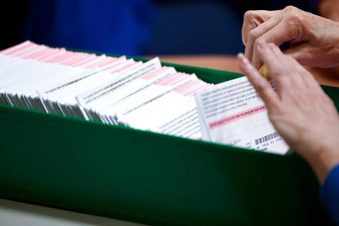 Ballots are processed by an election worker at the Clark County Election Department in North Las Vegas, Nevada.
