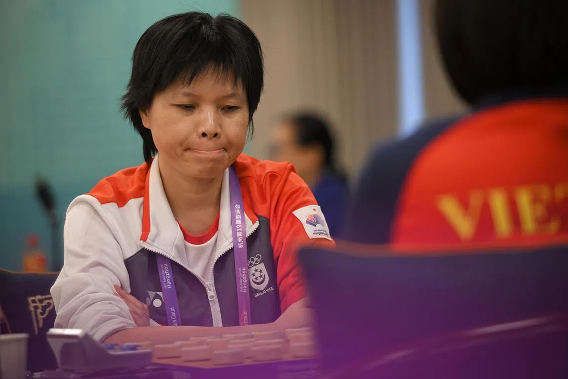 Ngo Lan Huong of Singapore during her match against Nguyen Hoang Yen of Vietnam during the women’s Xiangqi Individual Round 7 at the the Hangzhou Qiyuan Hall on Oct 7, 2023.