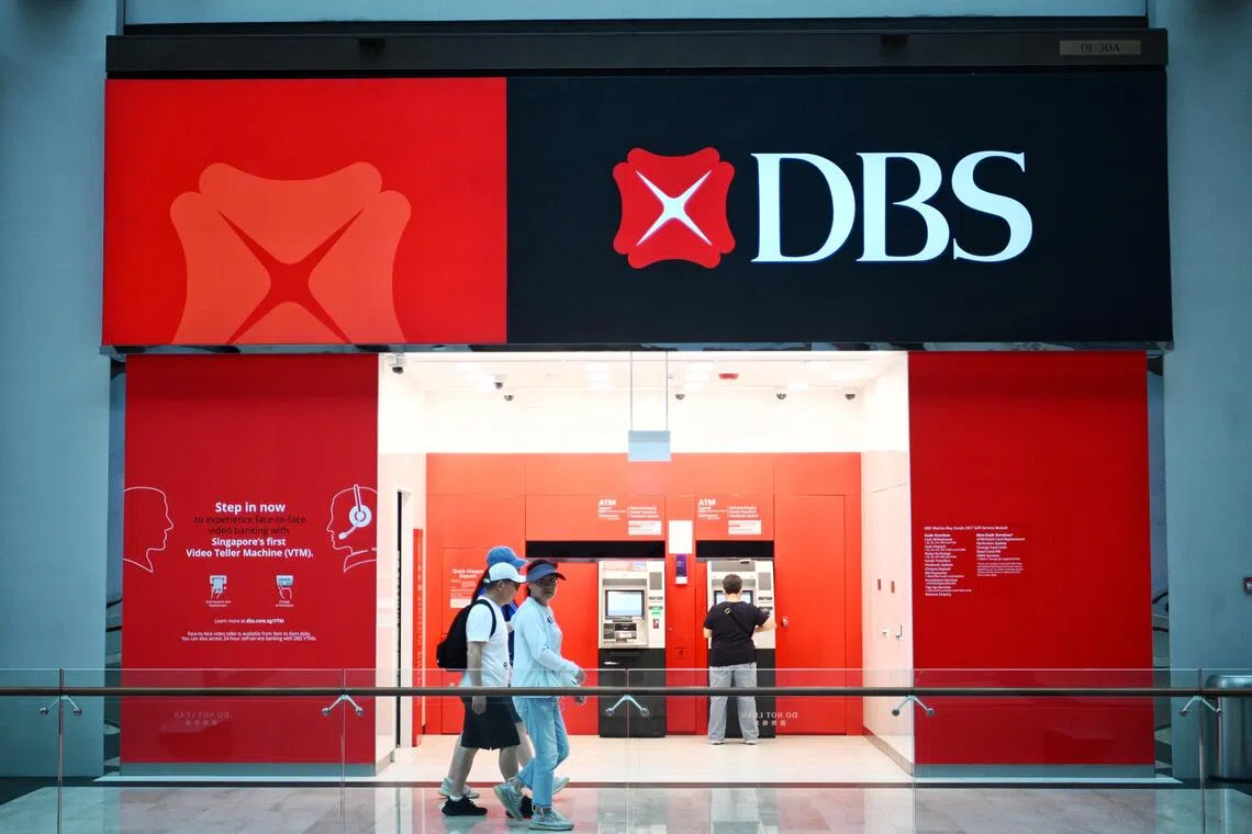 DBS' third-quarter net profit was down from a year ago but beat the $2.79 billion forecast by analysts in a Bloomberg poll.