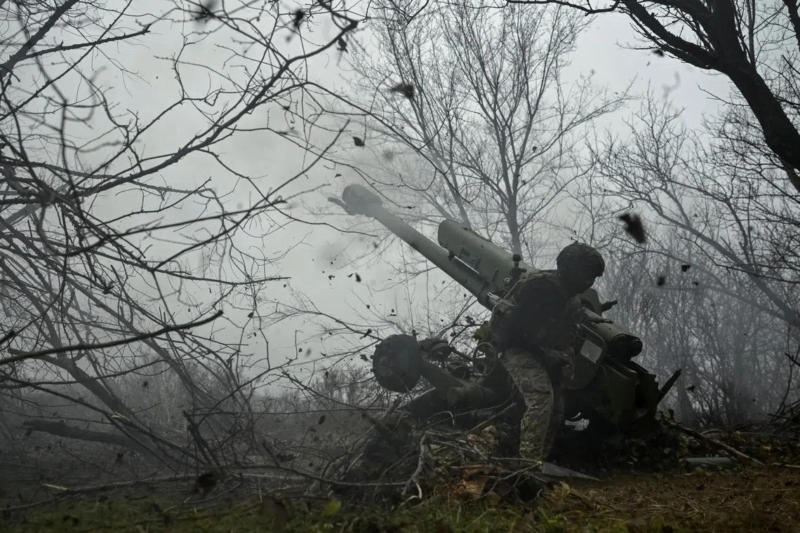 A Ukraine serviceman fires a D-30 howitzer towards Russian troops amid Russia's attack on Ukraine. 