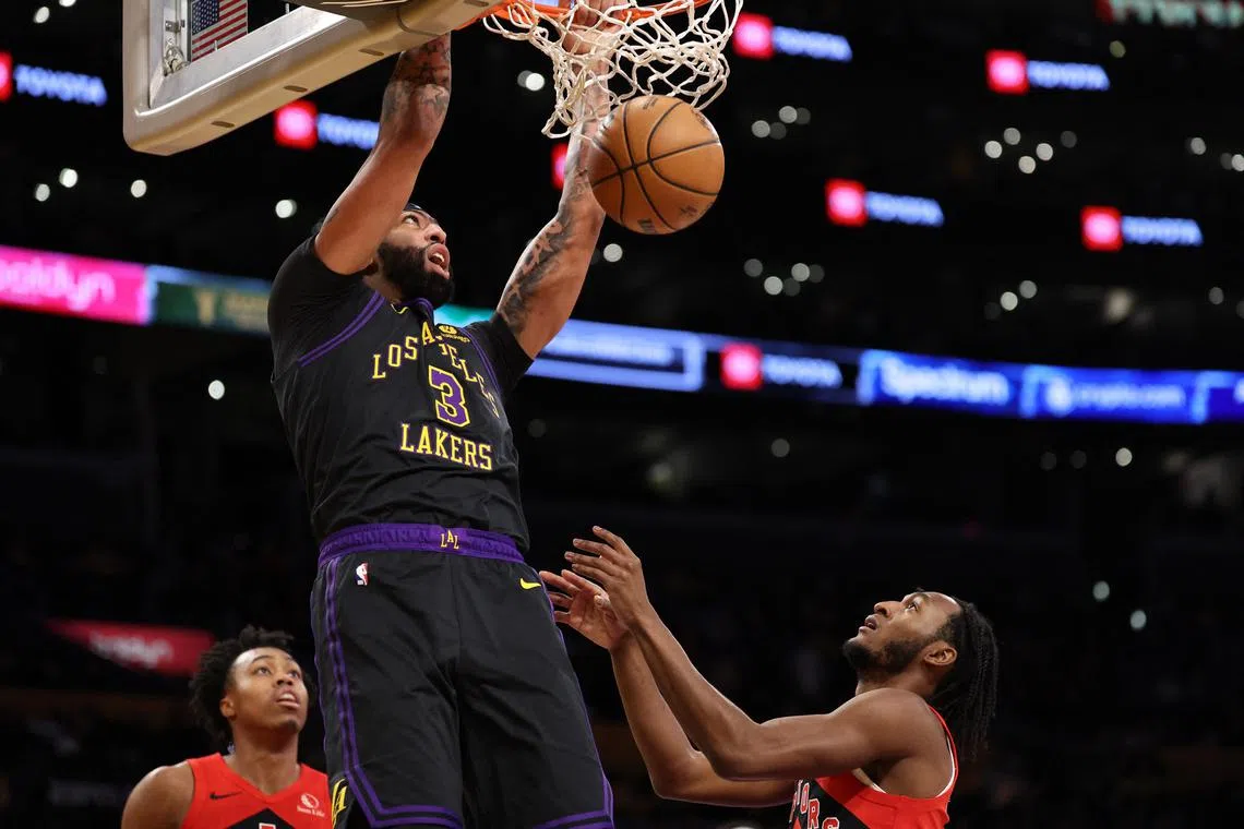 Los Angeles Lakers forward Anthony Davis dunks the ball during the first quarter against the Toronto Raptors at Crypto.com Arena.