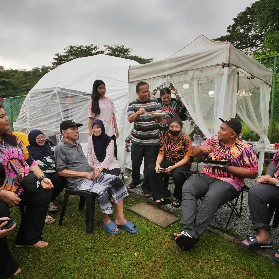 Mr Haris Husain (seated, in grey top) said his last wish is to go glamping by the sea with his family and create good memories with them.