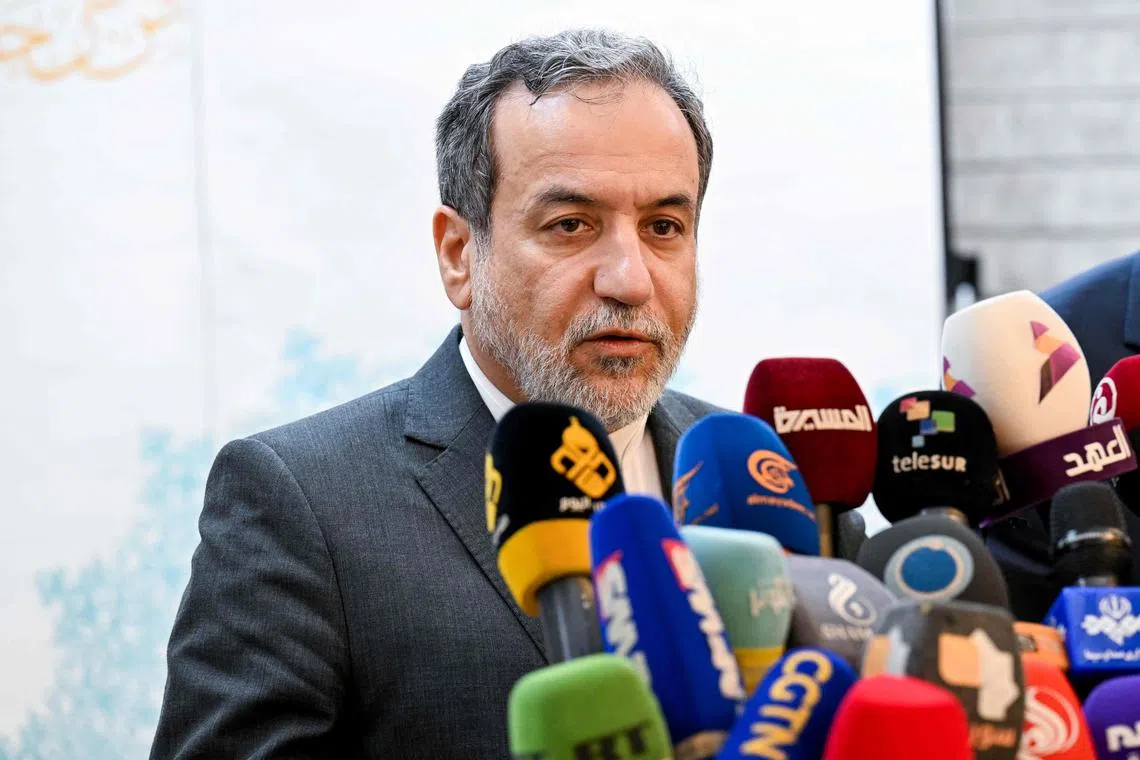 Iranian Foreign Minister Abbas Araghchi speaks to the press after meeting with Syrian officials at the Iranian embassy in Damascus on October 5, 2024. (Photo by LOUAI BESHARA / AFP)