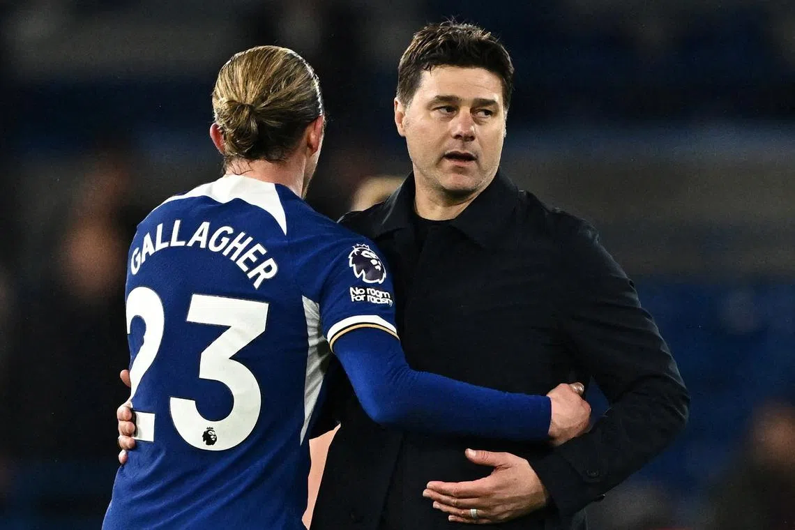 FILE PHOTO: Soccer Football - Premier League - Chelsea v Tottenham Hotspur - Stamford Bridge, London, Britain - May 2, 2024  Chelsea's Conor Gallagher with manager Mauricio Pochettino after the match REUTERS/Dylan Martinez/File Photo