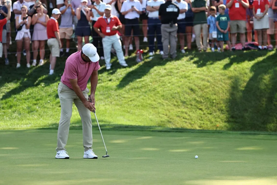 Jun 29, 2026; Cromwell, Connecticut, USA; Scottie Scheffler putts on the 18th green during the final round of the Travelers Championship golf tournament. Mandatory Credit: John Dufour-Imagn Images