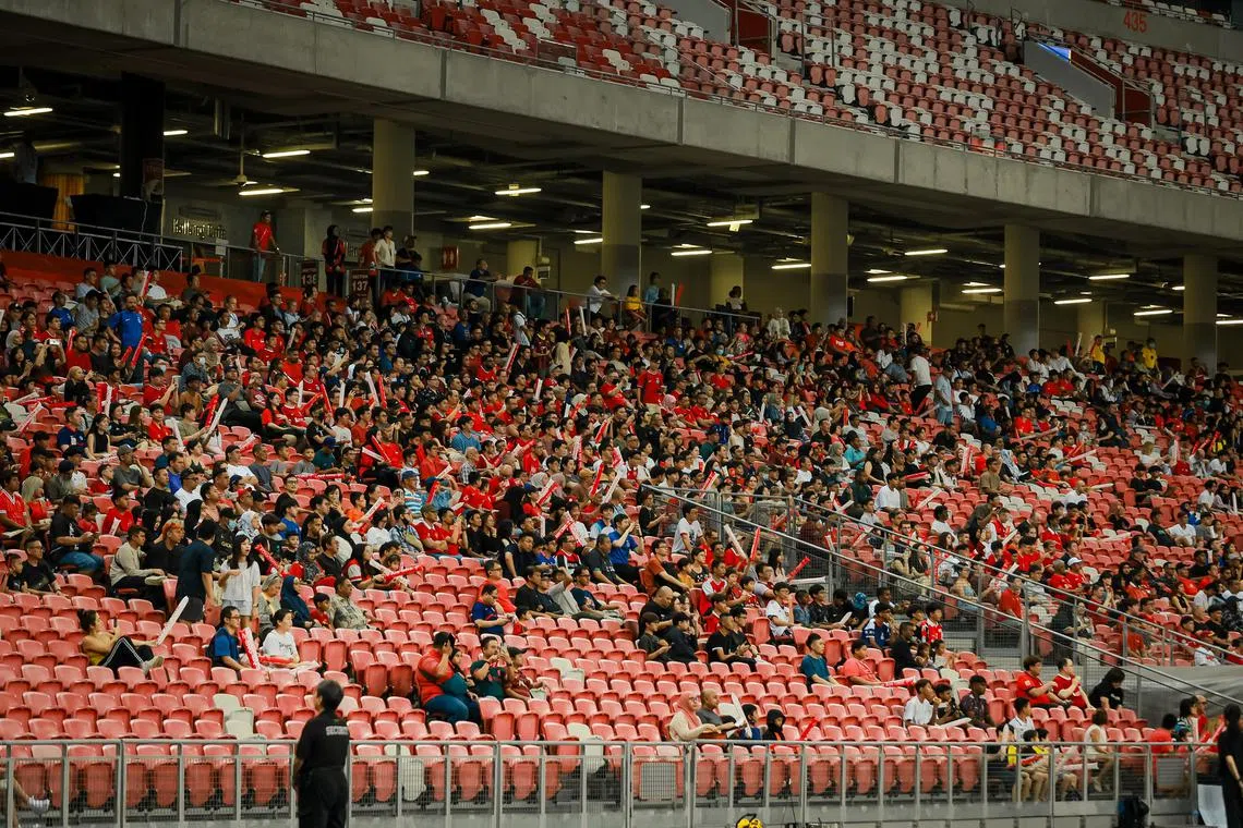 Spectators at the international football friendly match between Singapore and Solomon Islands at the National Stadium, June 18, 2023.