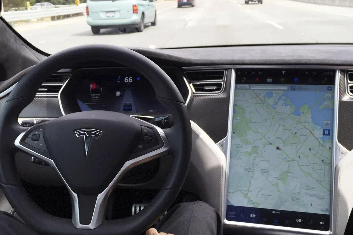 A file photo of the interior of a Tesla Model S in autopilot mode in San Francisco, California.