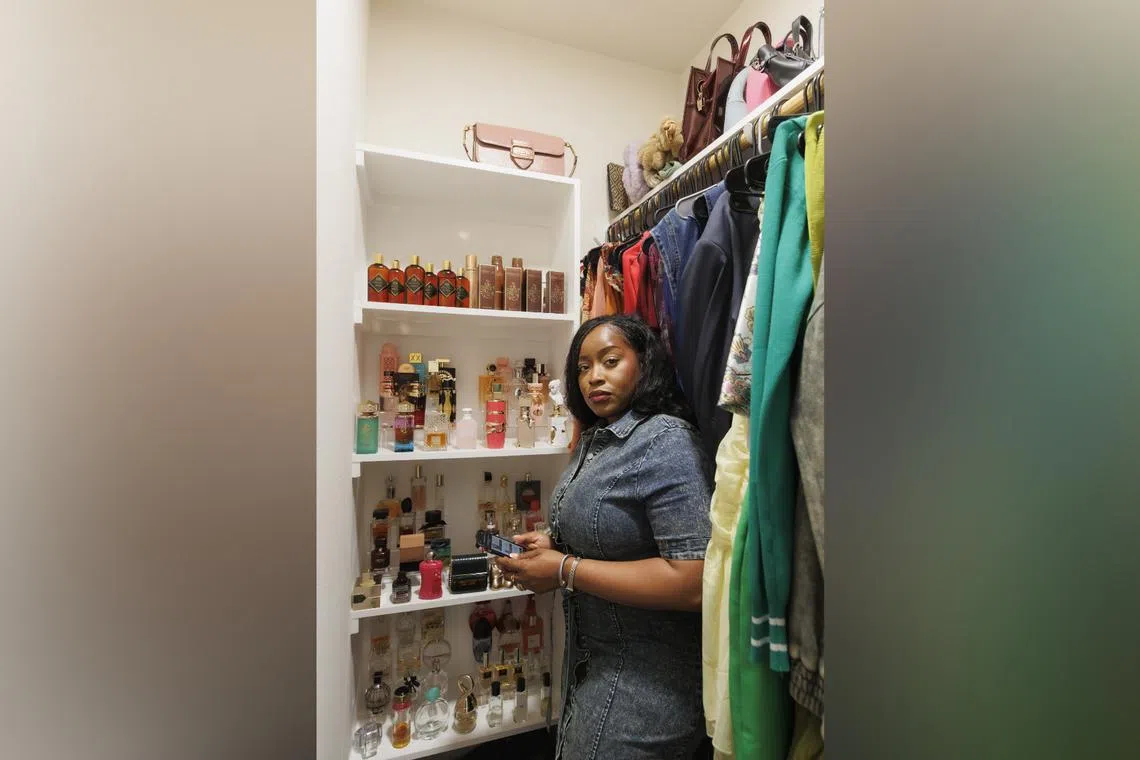 Ms Cassandra Orakpo, who has pledged to slow down her online buying habit this year, with the collection of perfumes she keeps in a closet.