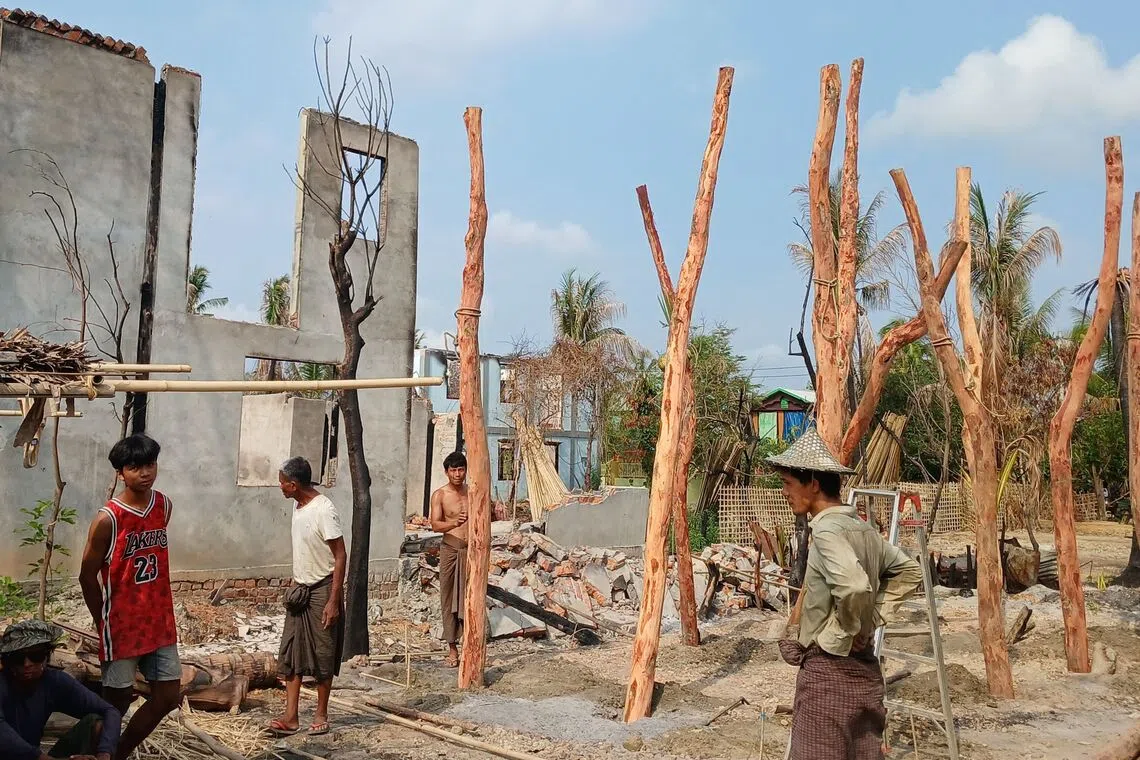 People building temporary homes following fighting between Myanmar's military and the Arakan Army ethnic minority armed group in Rakhine state in May 2024.
