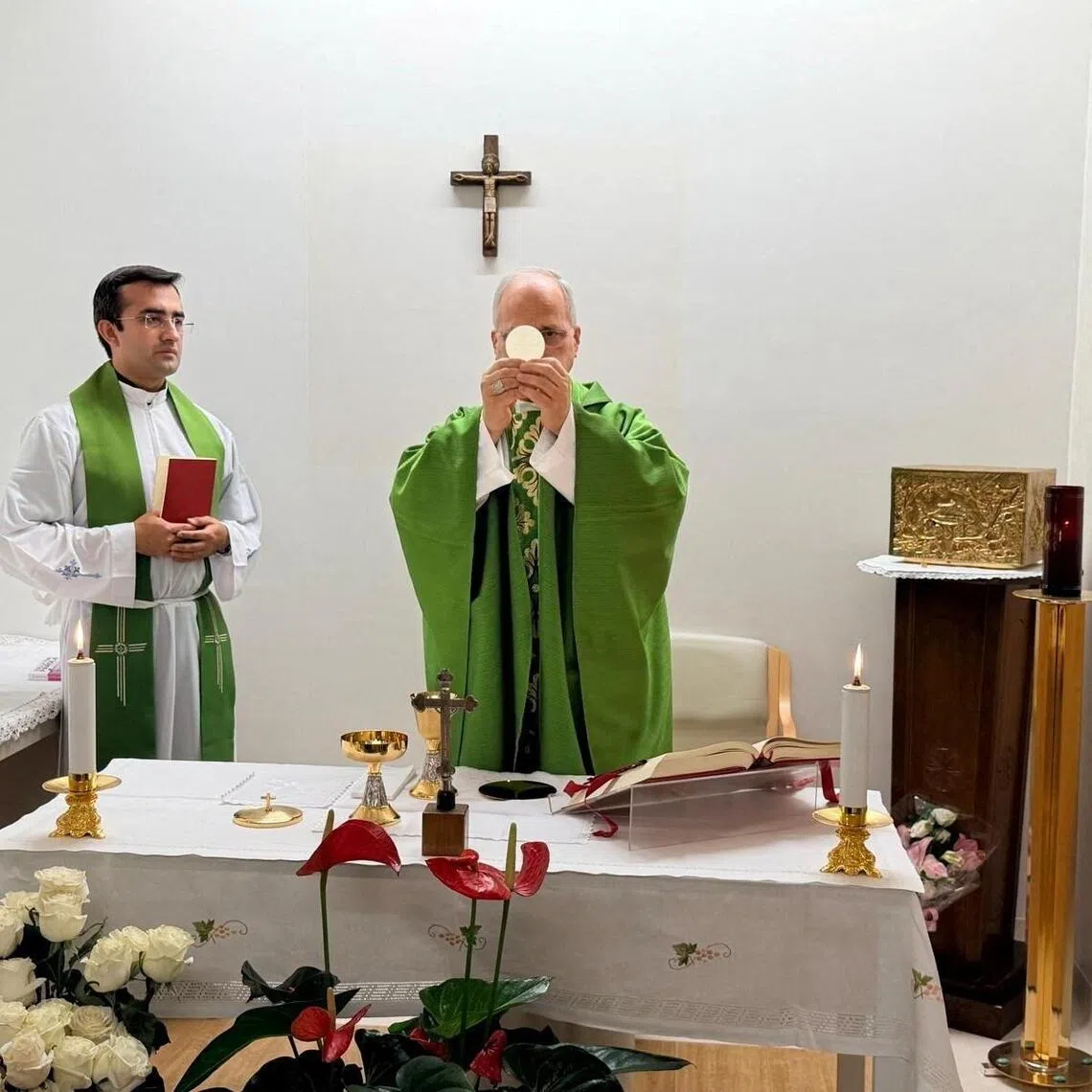 Pope Leo celebrating mass in a room in Rome’s Gemelli Hospital, attended by off-duty medical staff and members of the Vatican Gendarmerie, on Oct 16.
