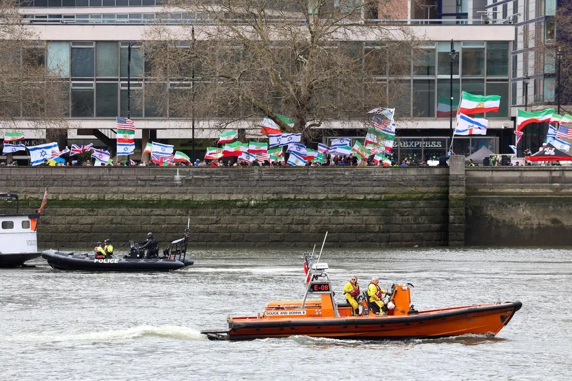 FILE PHOTO: Police officers and a crew of an RNLI lifeboat patrol the River Thames on the day of a static protest to mark Al-Quds Day in support of the Palestinian people organised by the Islamic Human Rights Commission and a counter-protest, in London, Britain, March 15, 2026. REUTERS/Toby Shepheard/File Photo
